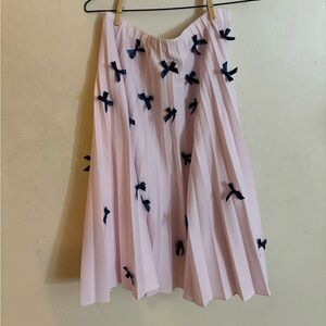 Pleated bow skirt